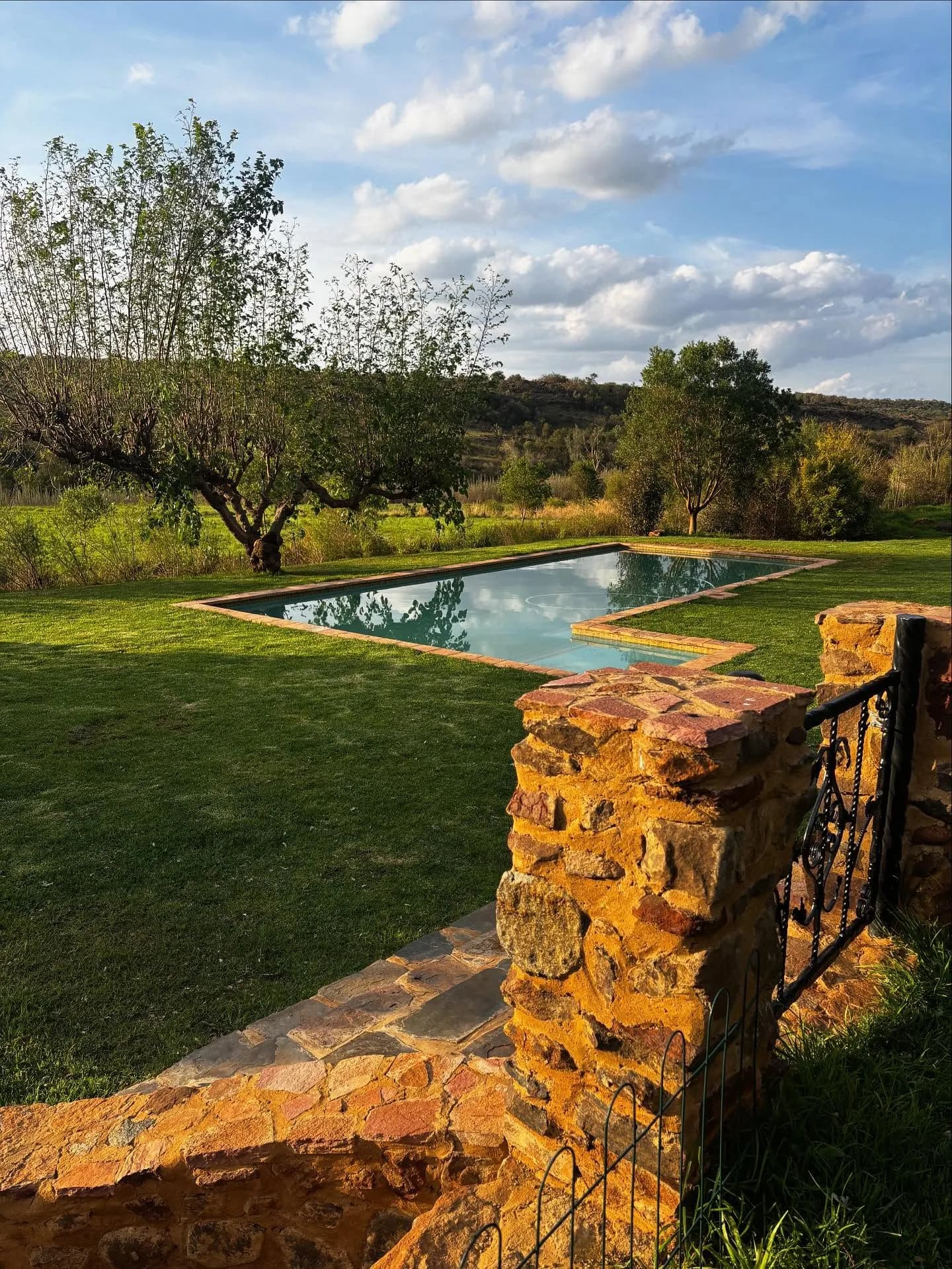 The shared swimming pool overlooking the Magaliesberg landscape